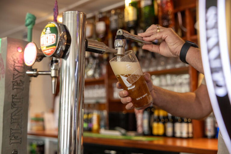 A beer being poured from tap