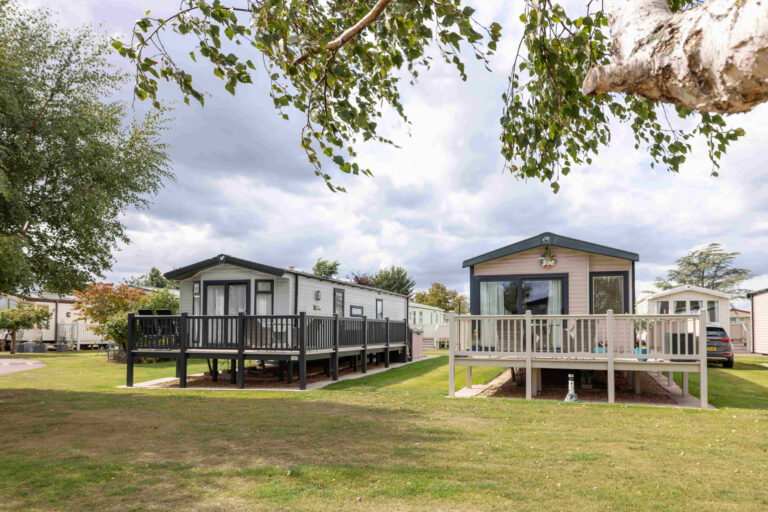 Caravan holiday homes with neat lawns between